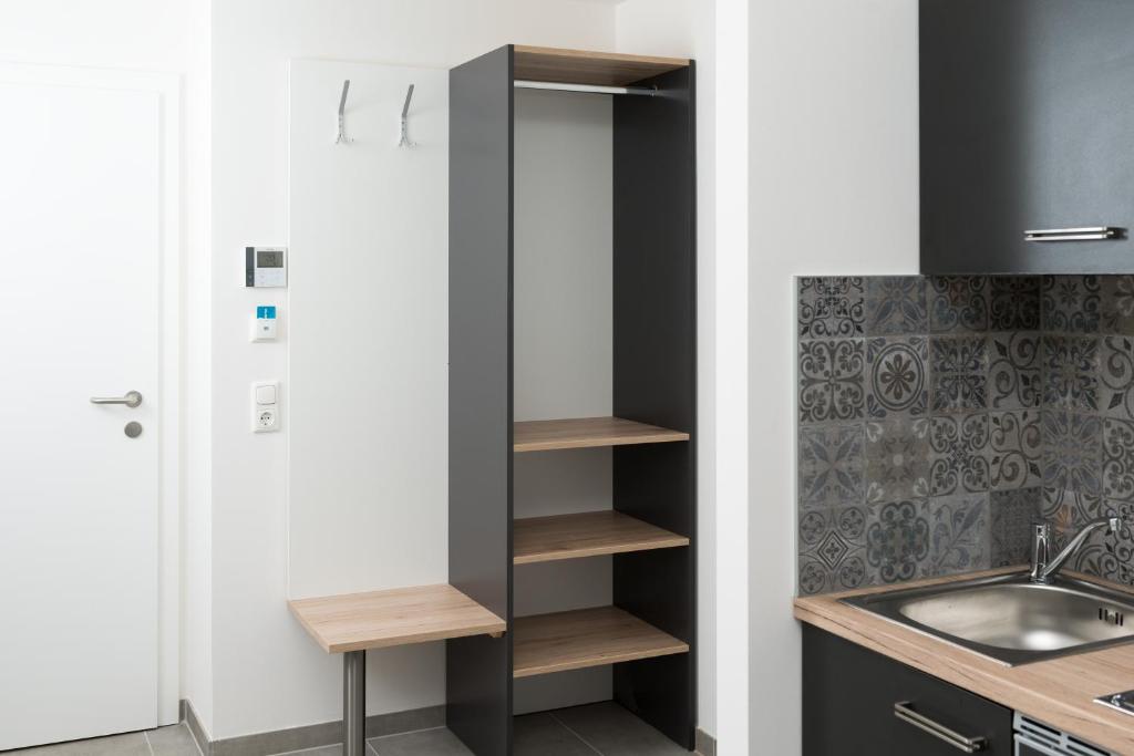 Kuchyň nebo kuchyňský kout v ubytování MOTEL24seven