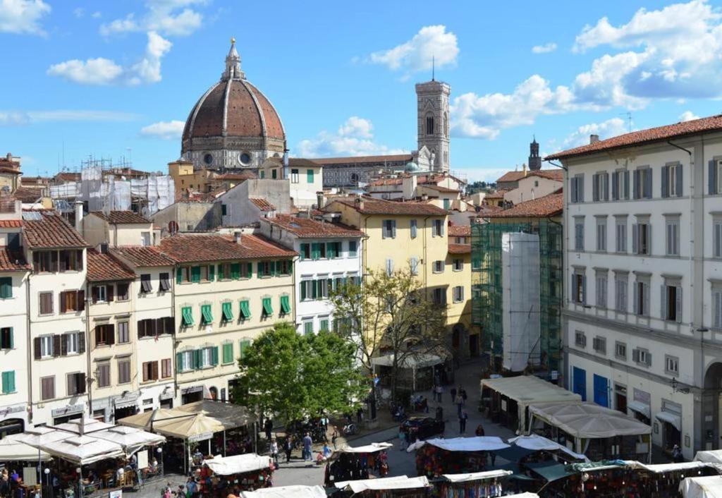 a view of a city with buildings and shops at Panoramic Suite near Duomo and Station in Florence