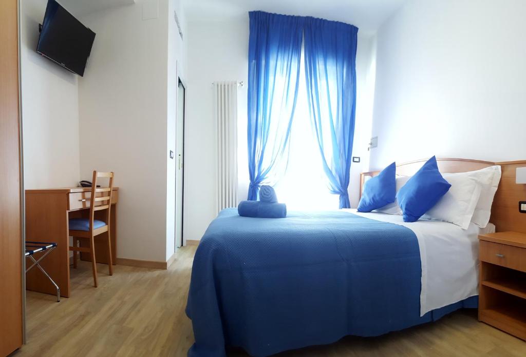 Кровать или кровати в номере Hotel Mare Blu -- boutique