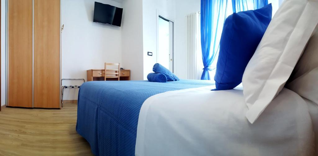 Кровать или кровати в номере Hotel Mare Blu -- boutique