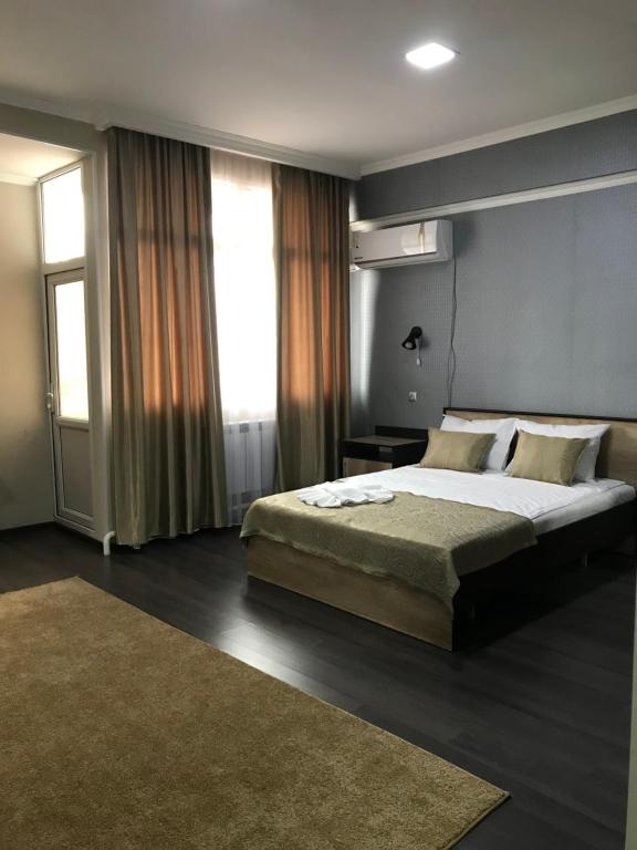 Postel nebo postele na pokoji v ubytování ORIENT