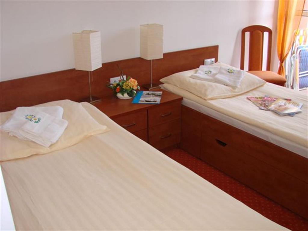 Postel nebo postele na pokoji v ubytování Hotel Ustka