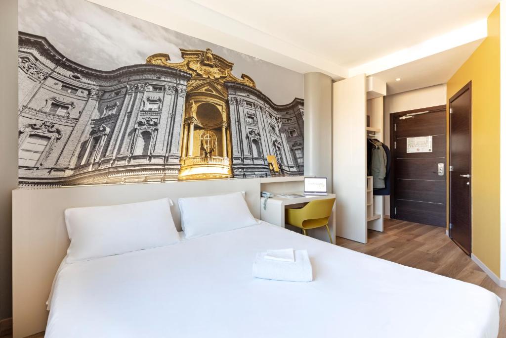 Säng eller sängar i ett rum på B&B HOTEL Torino Orbassano