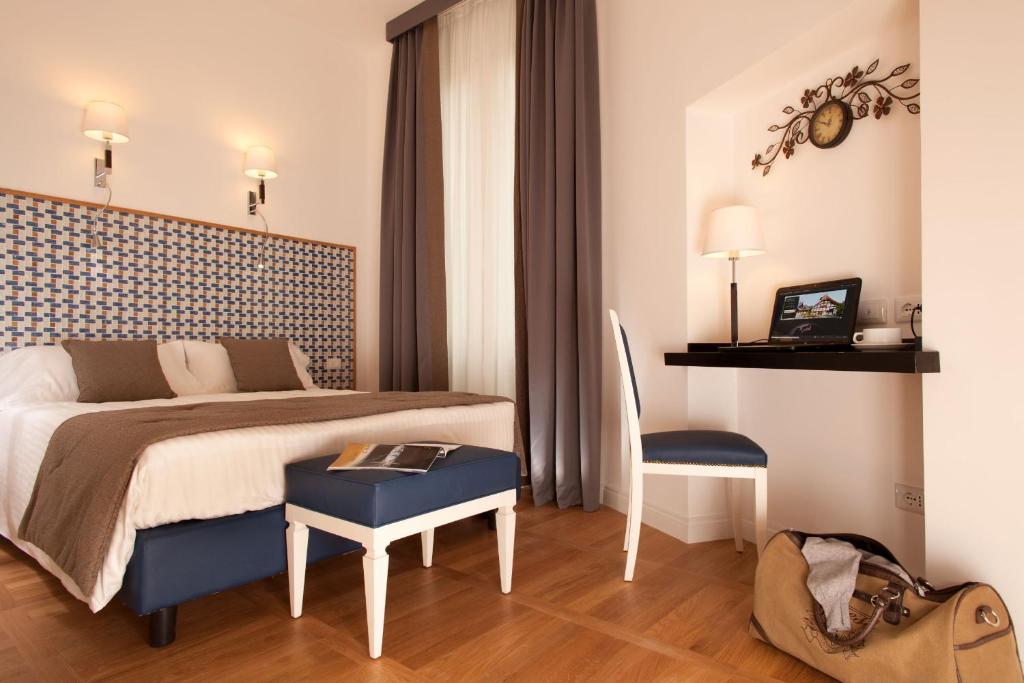 Postel nebo postele na pokoji v ubytování Floris Hotel