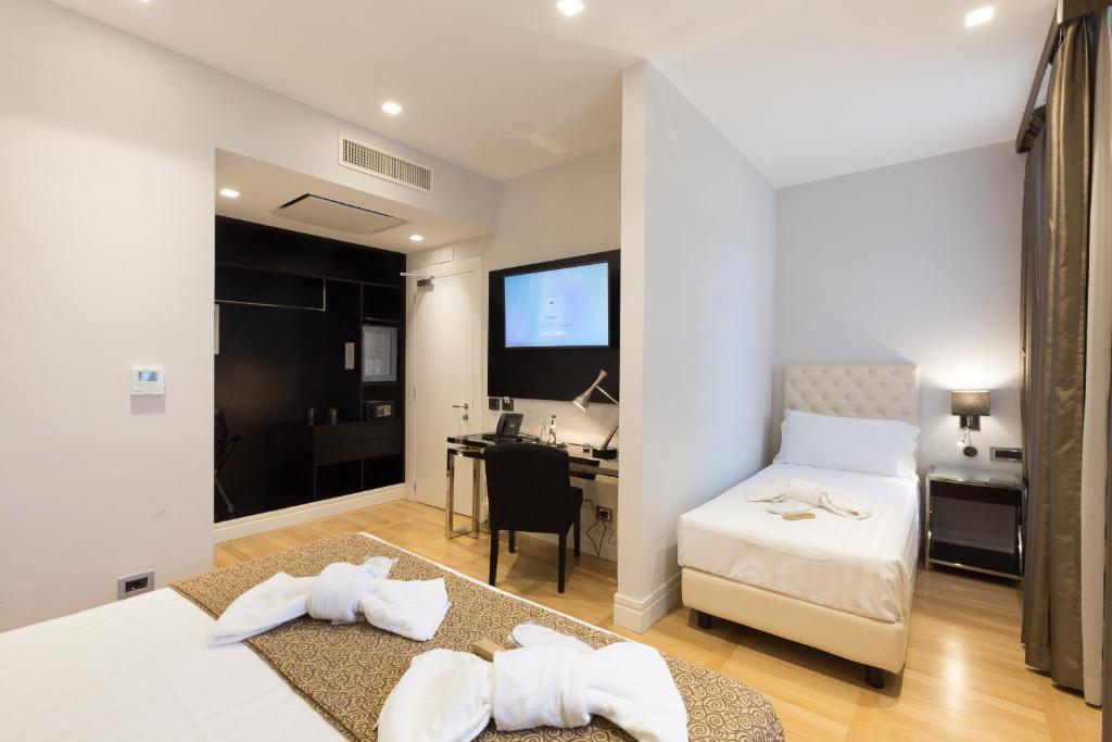 Postel nebo postele na pokoji v ubytování Floris Hotel