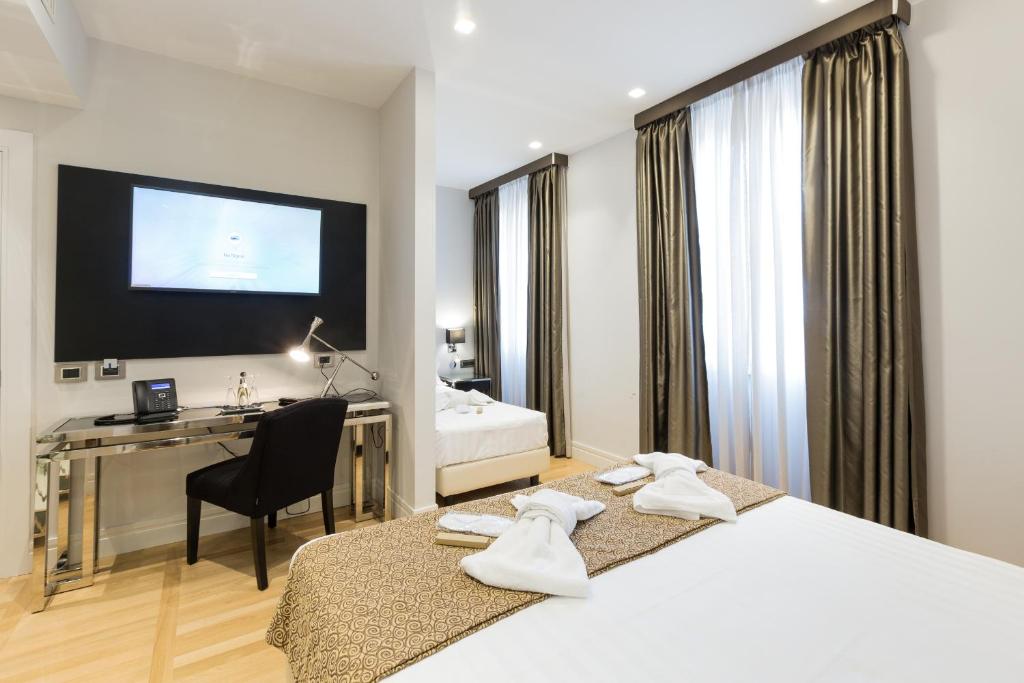 Postel nebo postele na pokoji v ubytování Floris Hotel