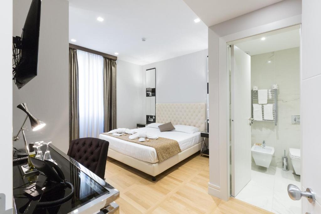 Postel nebo postele na pokoji v ubytování Floris Hotel