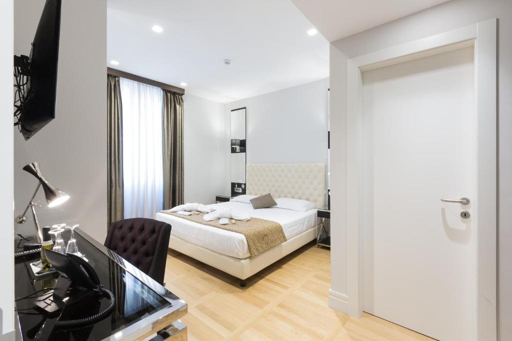 Postel nebo postele na pokoji v ubytování Floris Hotel