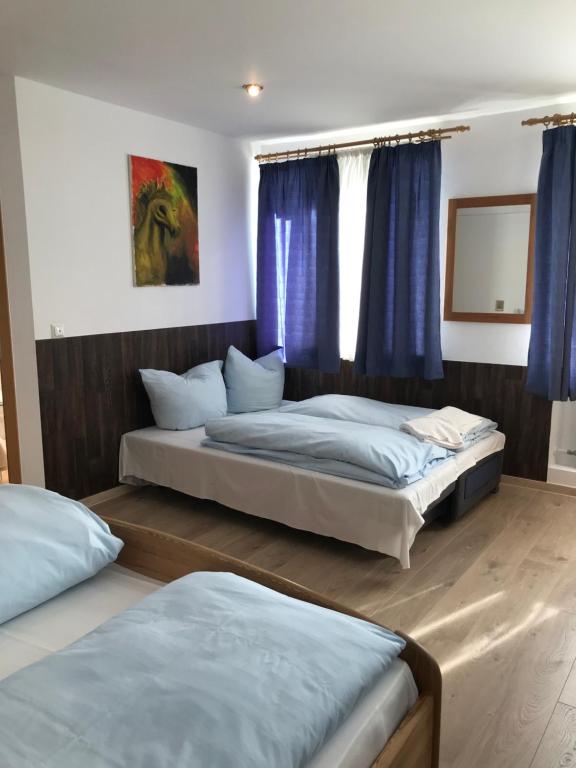 Postel nebo postele na pokoji v ubytování Hotel Guntia Boardinghouse