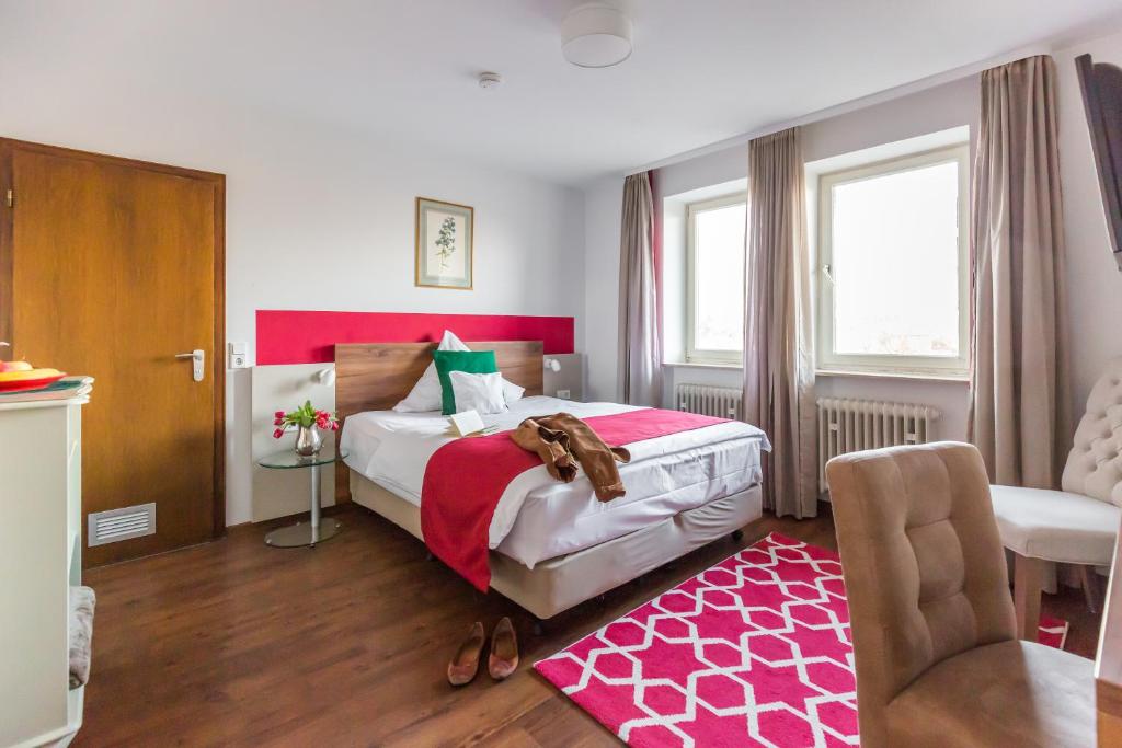 Postel nebo postele na pokoji v ubytování Hotel Vorderburg