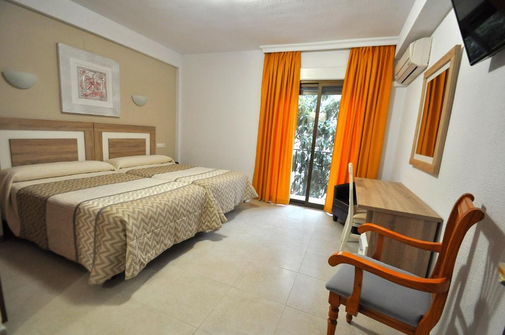 Postel nebo postele na pokoji v ubytování Hotel Goya