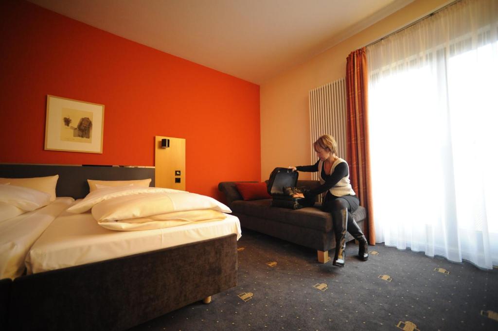 Postel nebo postele na pokoji v ubytování Hotel Theresientor
