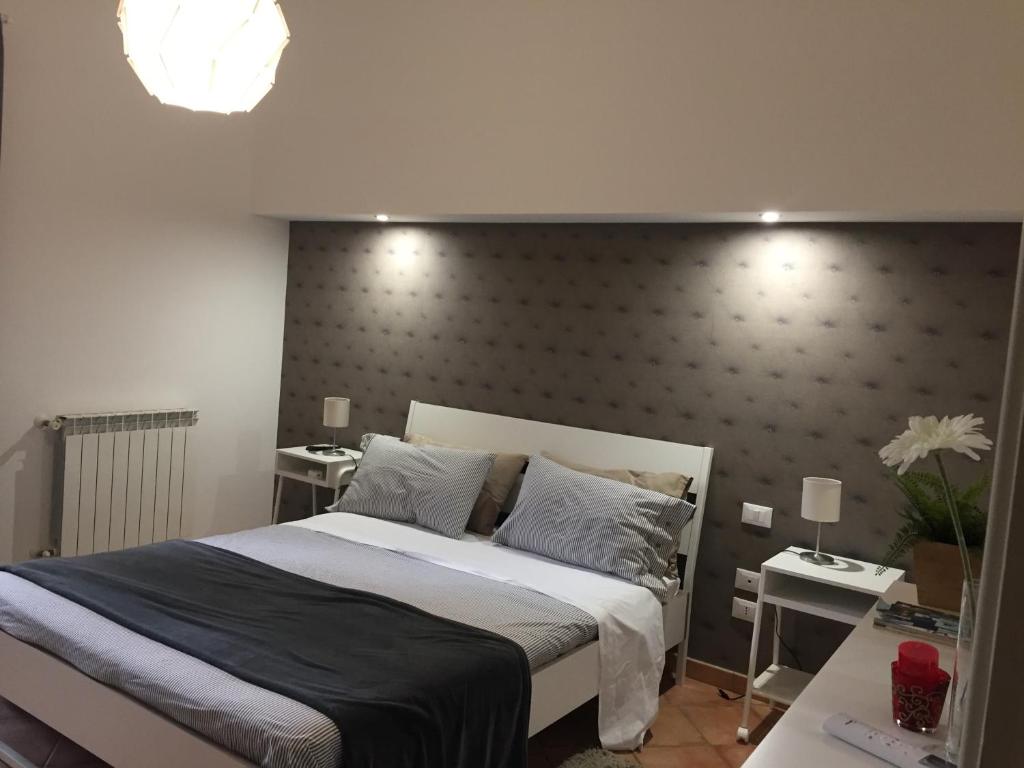 Łóżko lub łóżka w pokoju w obiekcie Etna Holidays Home SereLeo