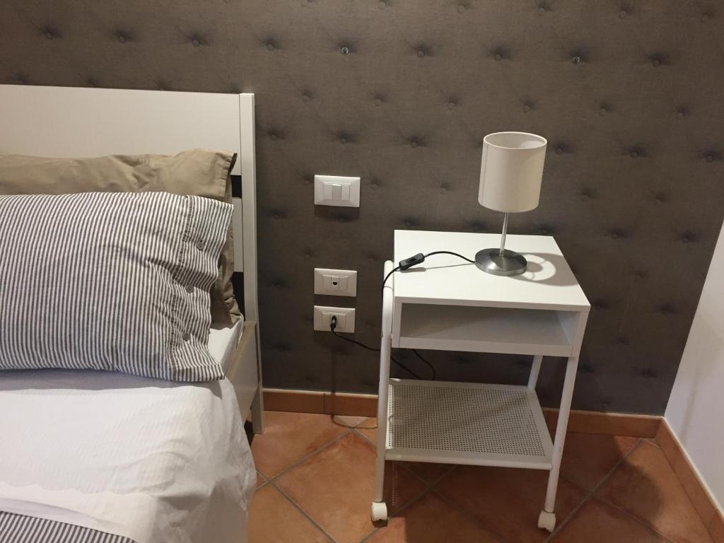 Łóżko lub łóżka w pokoju w obiekcie Etna Holidays Home SereLeo