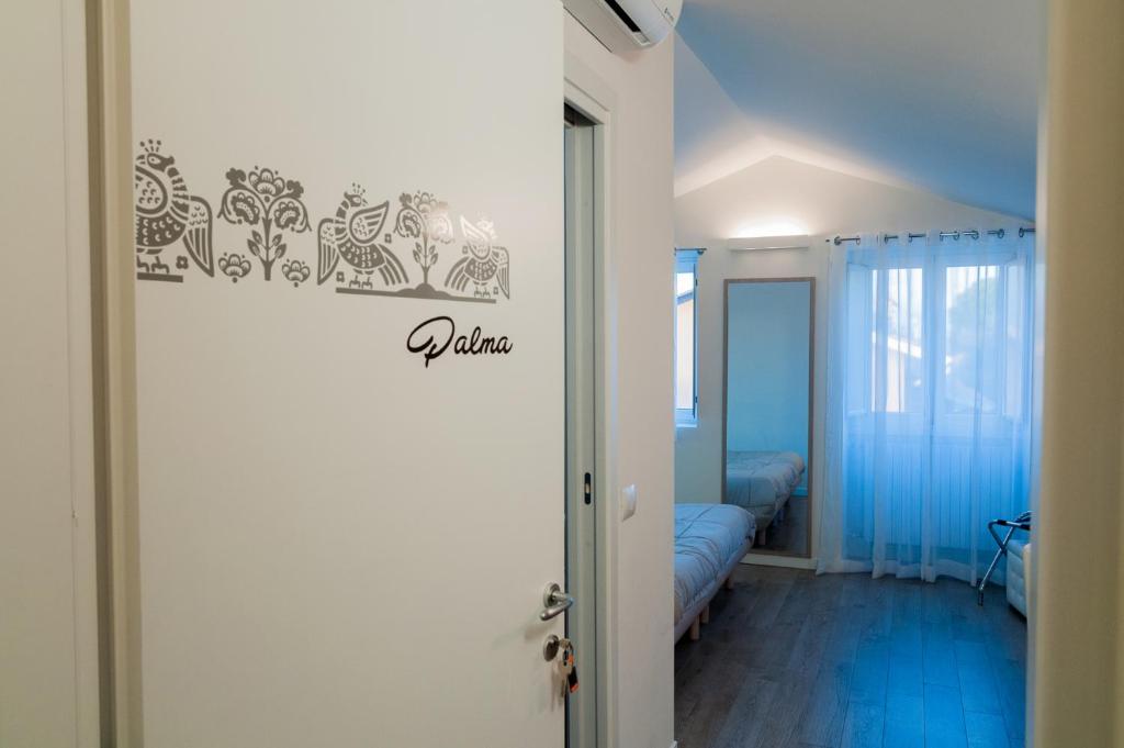 Postel nebo postele na pokoji v ubytování VILLA FENIX OSIO SOTTO