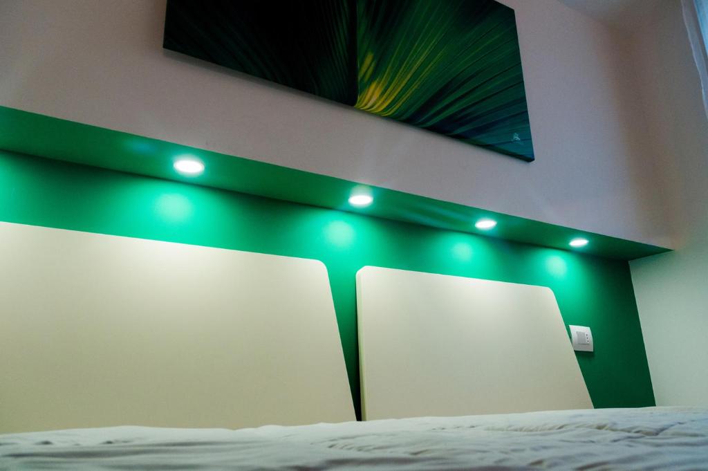 Postel nebo postele na pokoji v ubytování VILLA FENIX OSIO SOTTO