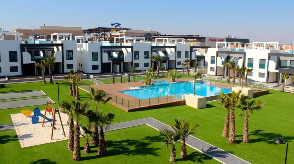 an image of an apartment complex with a swimming pool at Penthouse 86 LA ZENIA boulevard in Orihuela