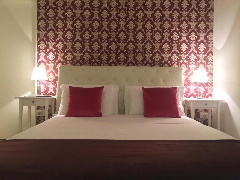 Postel nebo postele na pokoji v ubytování Dimora San Biagio Suites&Apartment