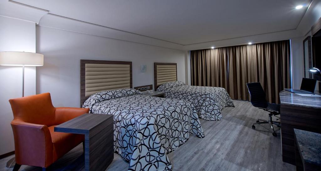 TV a/nebo společenská místnost v ubytování Econo Express Hotel