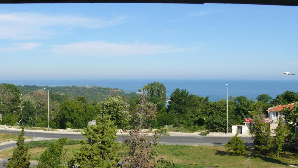 a view of a road with the ocean in the background at Villa Climate Guest House in Varna City