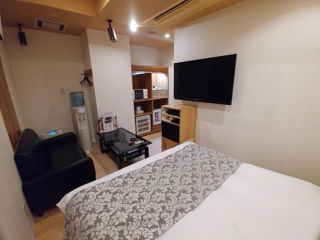 TV a/nebo společenská místnost v ubytování Hotel Allure (Adult Only)