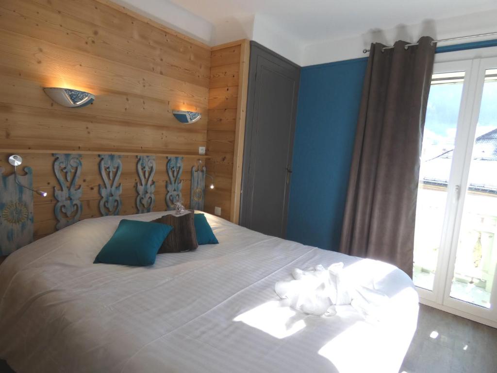 Postel nebo postele na pokoji v ubytování Hôtel Du Midi