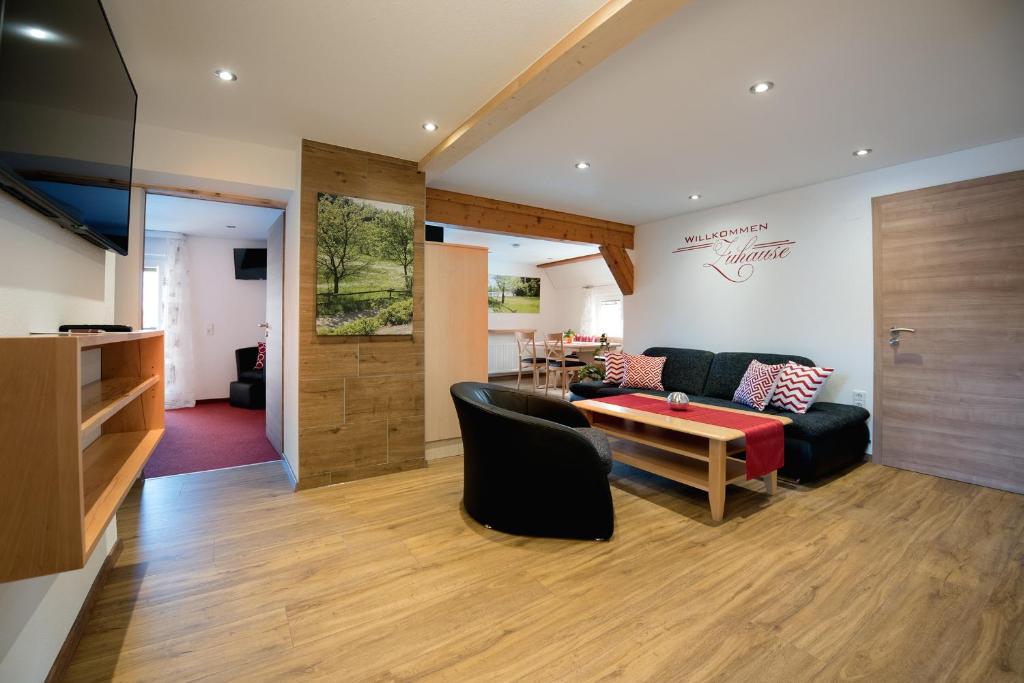 a living room with a couch and a table at Haus Hilda Fechtig in Ühlingen-Birkendorf