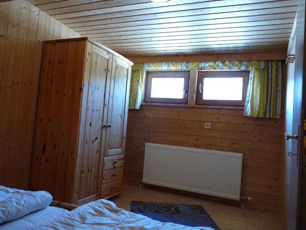 A bed or beds in a room at Ferienhaus Schäfer - Apartments - Wintersports - Family holiday - Holiday with your dog - Rural & Scenic
