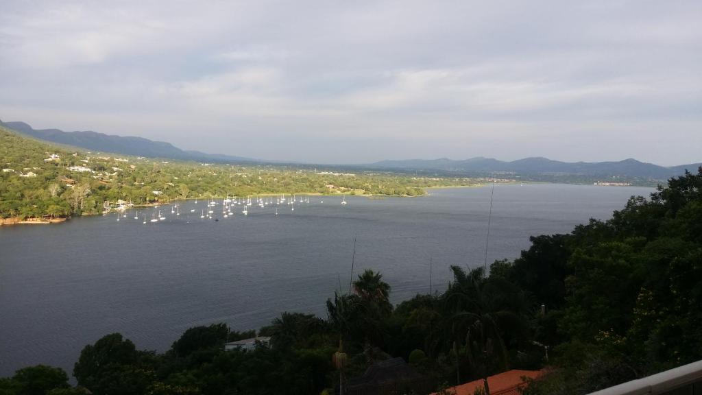 a view of a large lake with boats in it at Letamong in Hartbeespoort