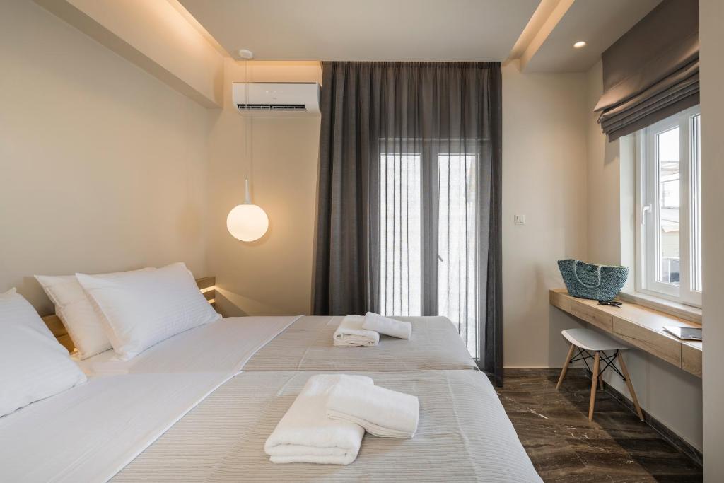 Posteľ alebo postele v izbe v ubytovaní Sun Ray Luxury Apartments