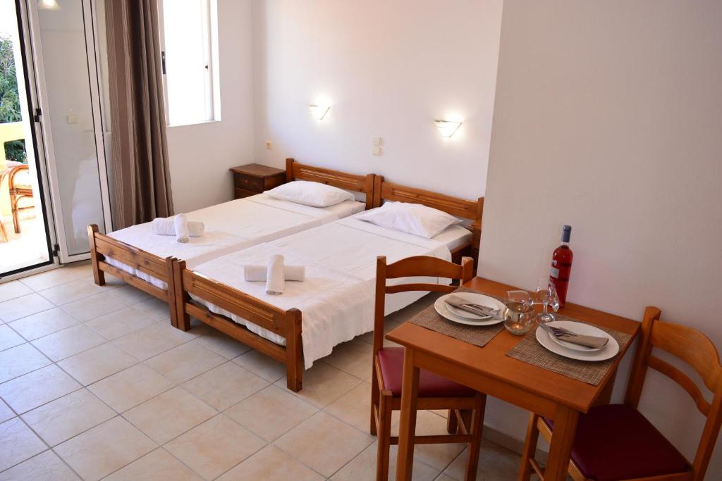 A bed or beds in a room at Raph's Studios-Apts By The Sea