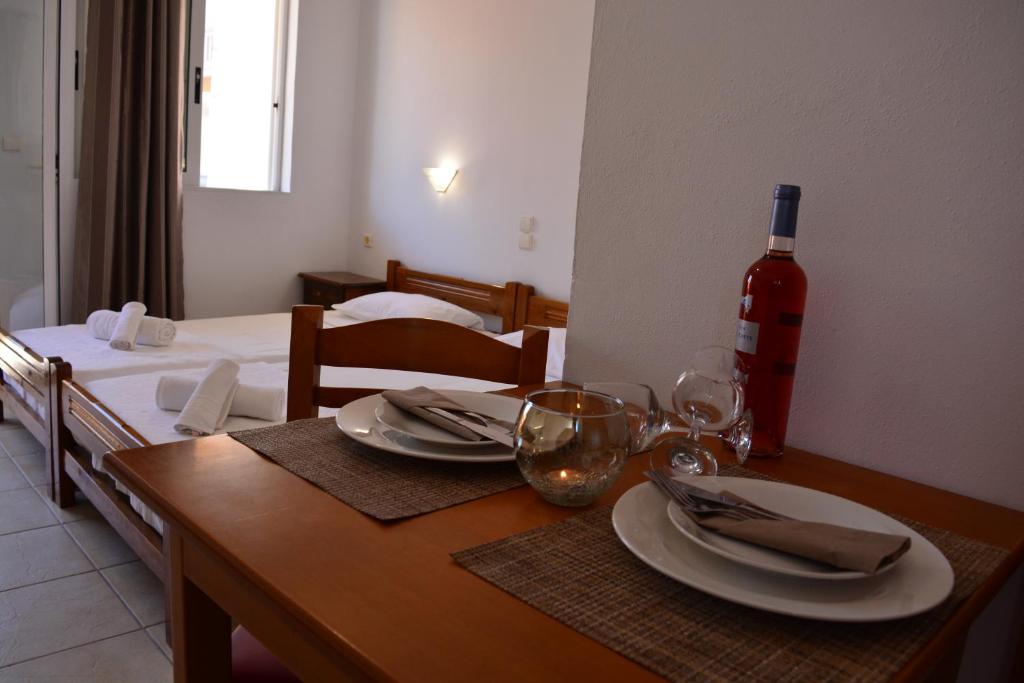 A bed or beds in a room at Raph's Studios-Apts By The Sea