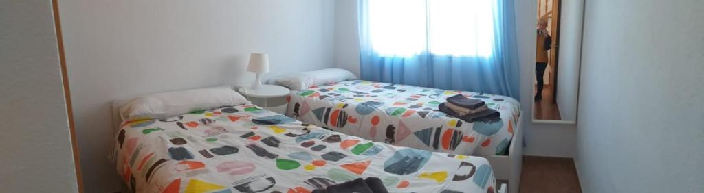 Postel nebo postele na pokoji v ubytování Apartament Casa Bonfill