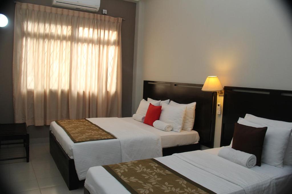 Postel nebo postele na pokoji v ubytování Sevana City Hotel