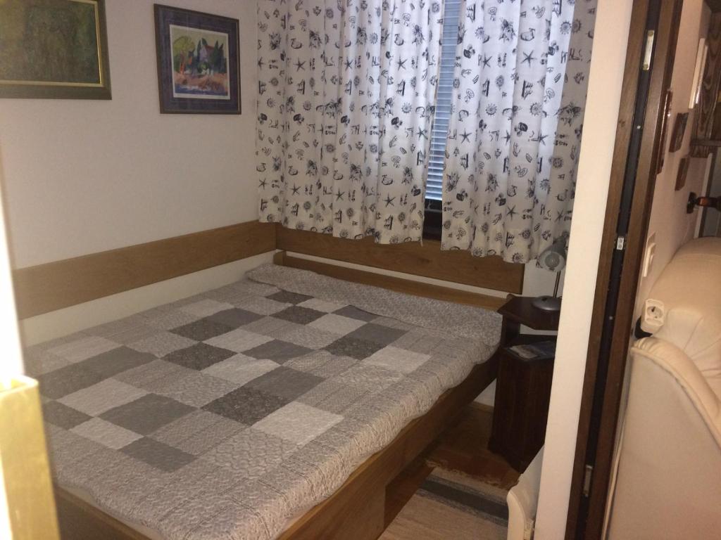 Postel nebo postele na pokoji v ubytování Apartment Dubravka I