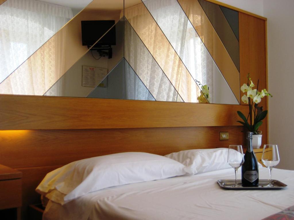 Postel nebo postele na pokoji v ubytování Albergo Ristorante Da Neni