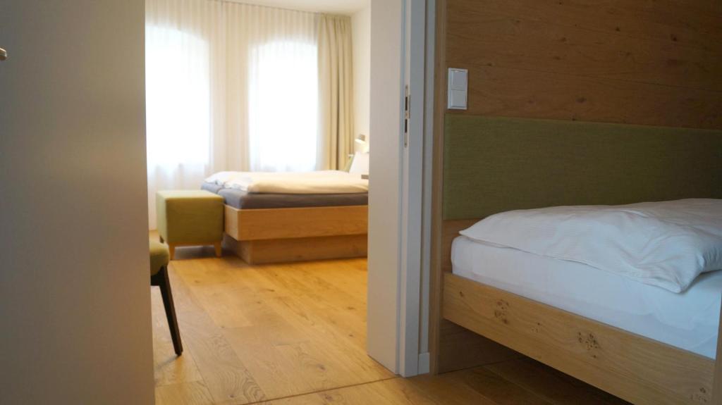 Postel nebo postele na pokoji v ubytování Boutique Hotel grüner Zweig