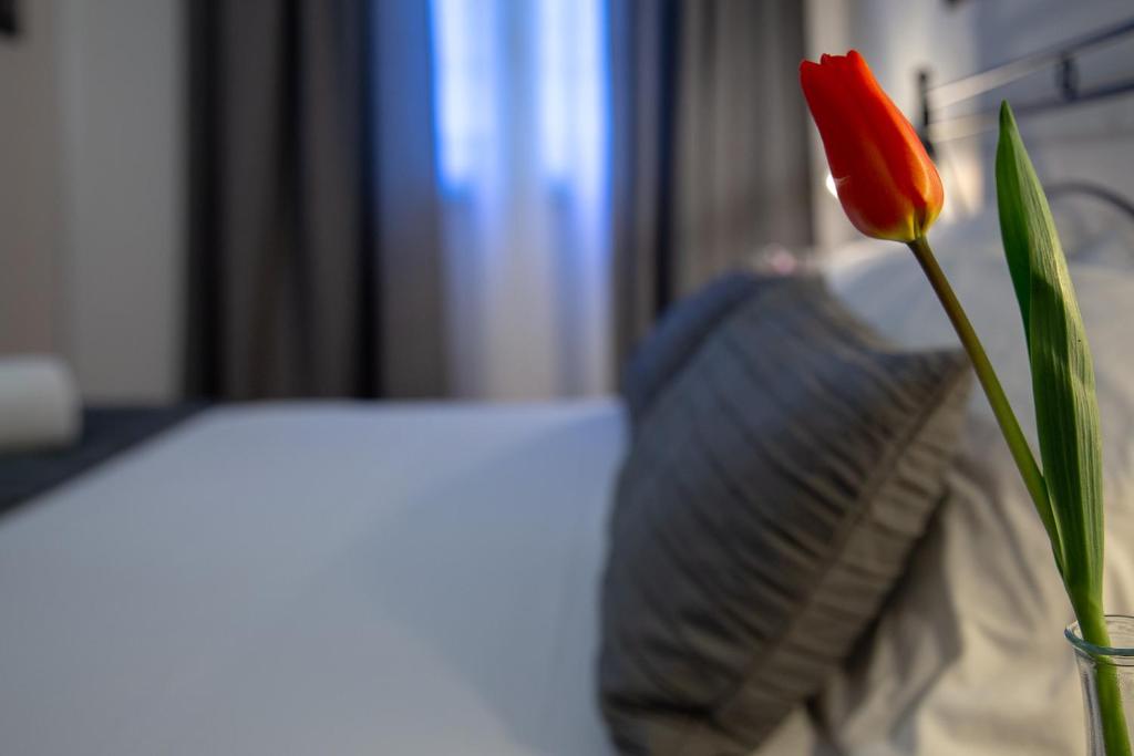 Postel nebo postele na pokoji v ubytování Holiday Rooms Portale Pirrera