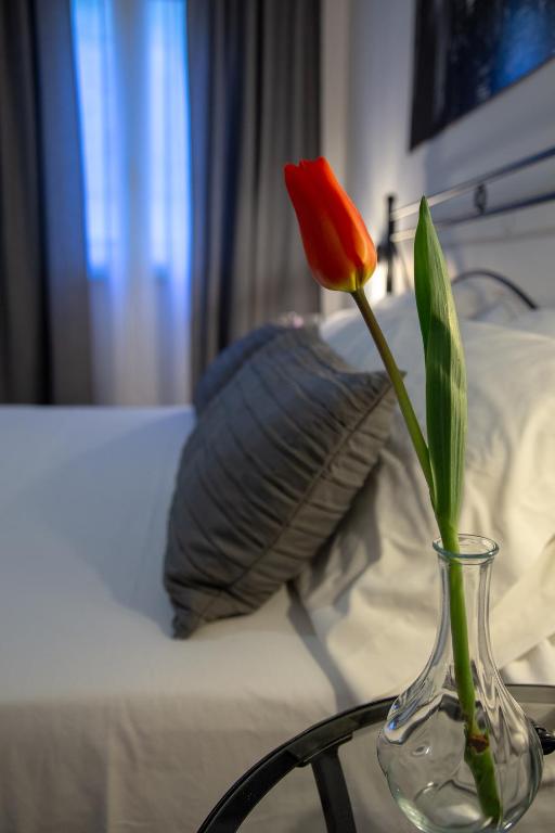 Postel nebo postele na pokoji v ubytování Holiday Rooms Portale Pirrera