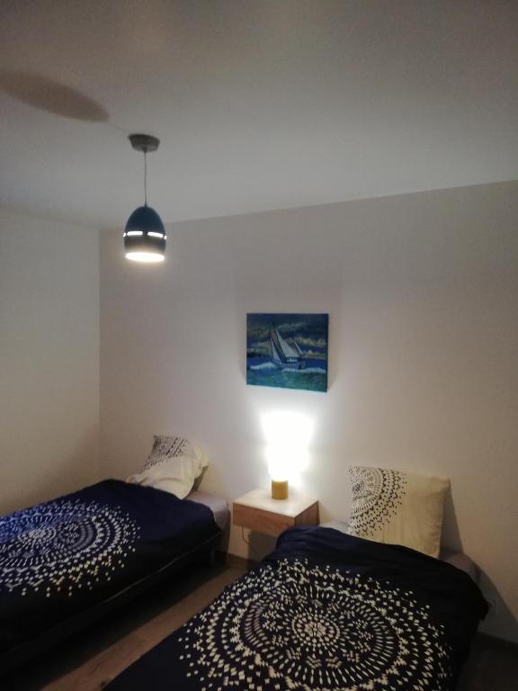 Postel nebo postele na pokoji v ubytování résidence des dunes