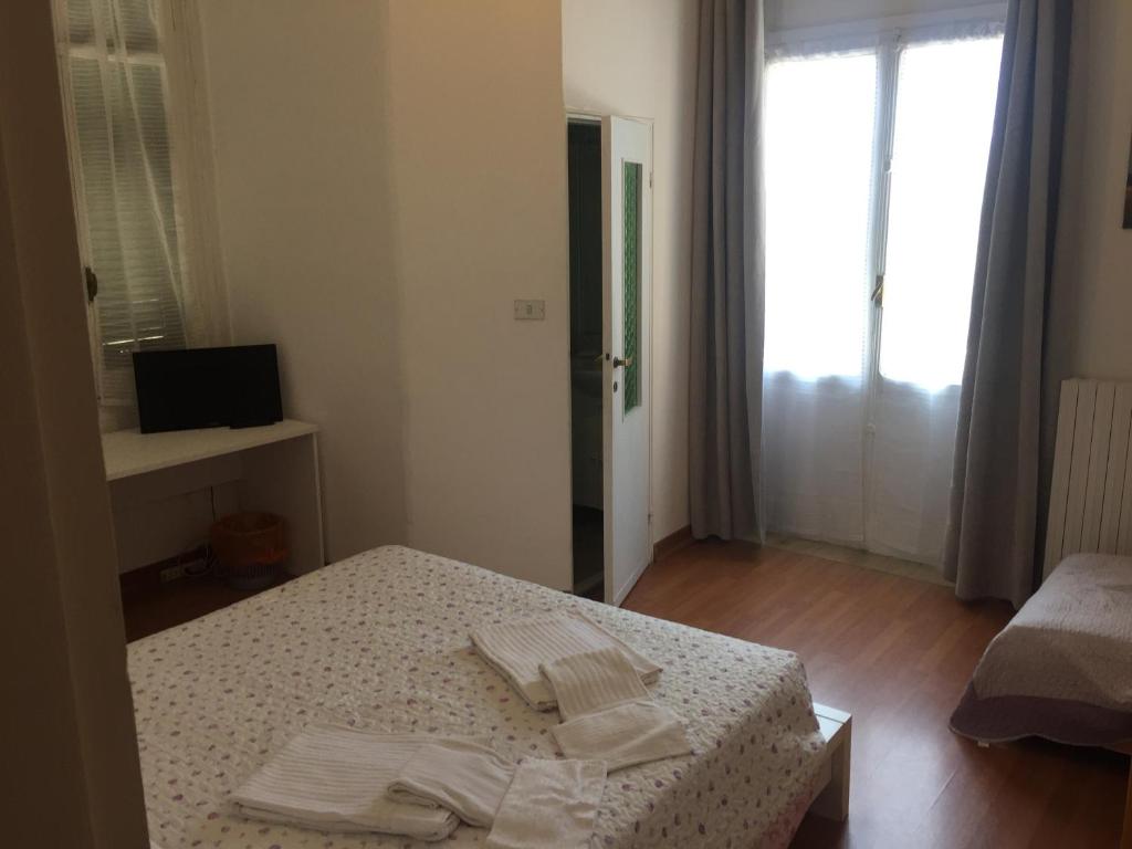 Łóżko lub łóżka w pokoju w obiekcie Hotel Villa Cristina