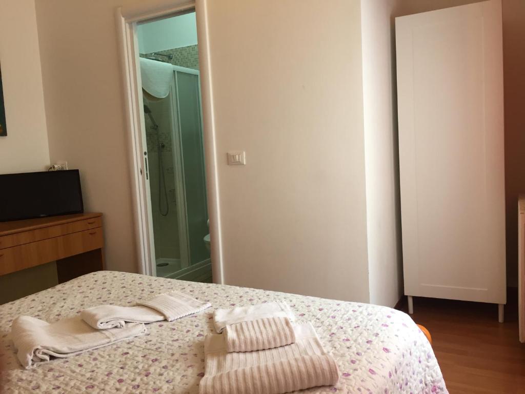 Łóżko lub łóżka w pokoju w obiekcie Hotel Villa Cristina