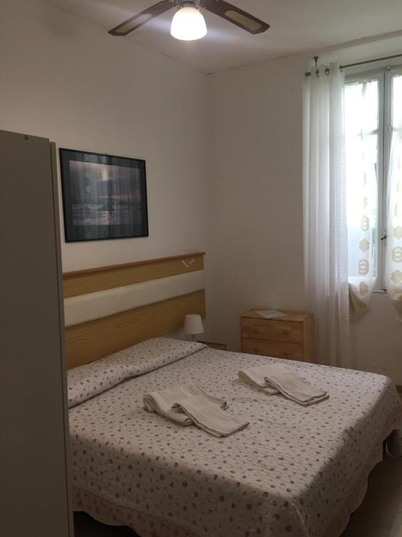 Łóżko lub łóżka w pokoju w obiekcie Hotel Villa Cristina