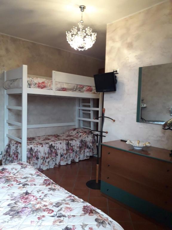 Postel nebo postele na pokoji v ubytování Villa Fabbri