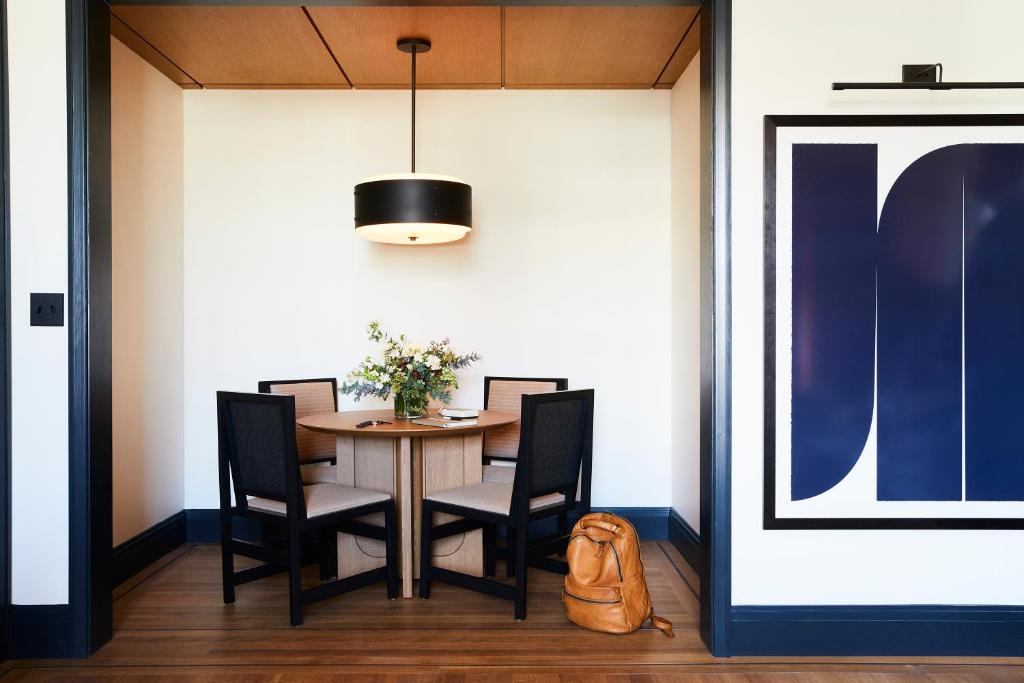 a dining room with a table and chairs at Shinola Hotel in Detroit
