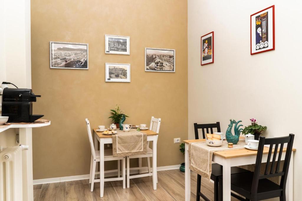 a dining room with a table and two chairs at Su Murdegu in Cagliari