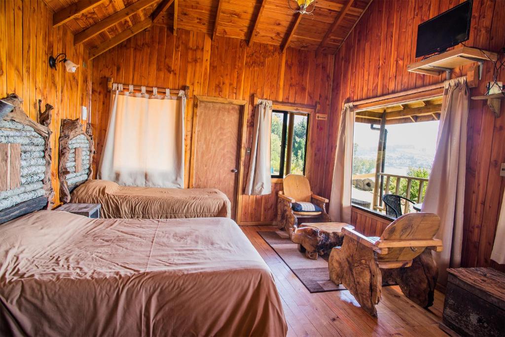 Postel nebo postele na pokoji v ubytování Apart hotel Puchaley Lafquen
