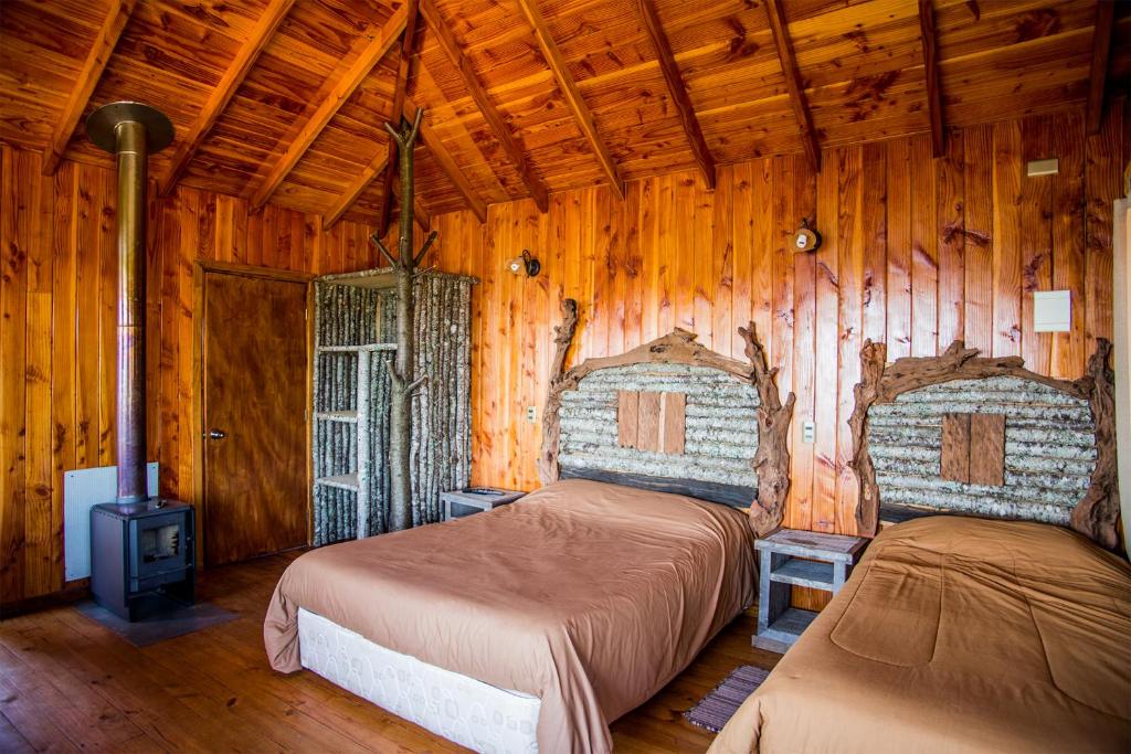Postel nebo postele na pokoji v ubytování Apart hotel Puchaley Lafquen