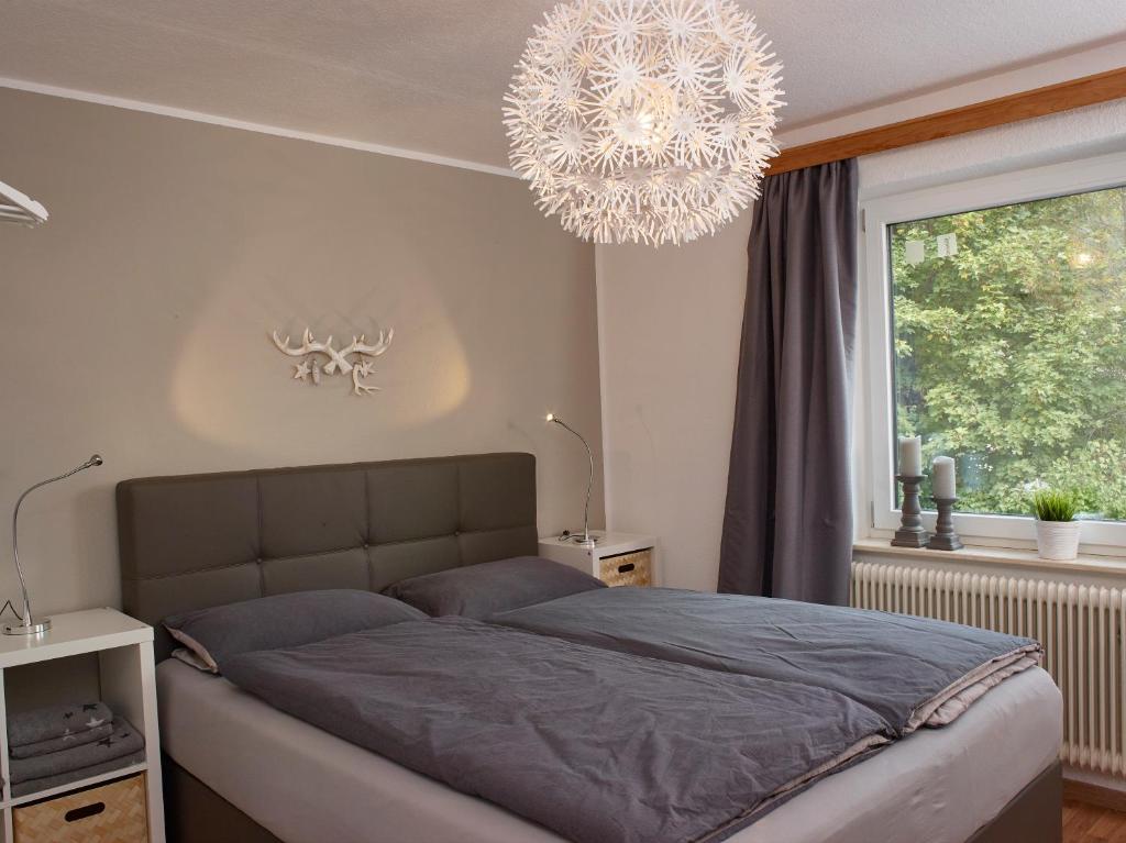 A bed or beds in a room at Karwendel Apartments II