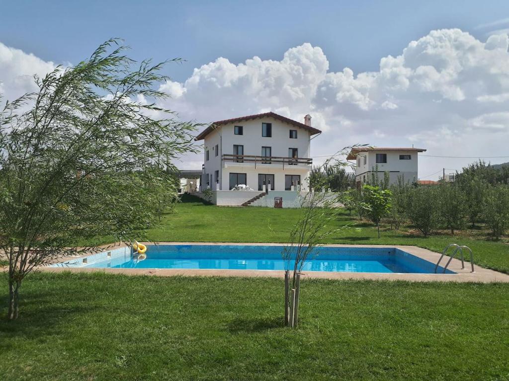 a house with a swimming pool in a yard at Villa SALAM in Ifrane